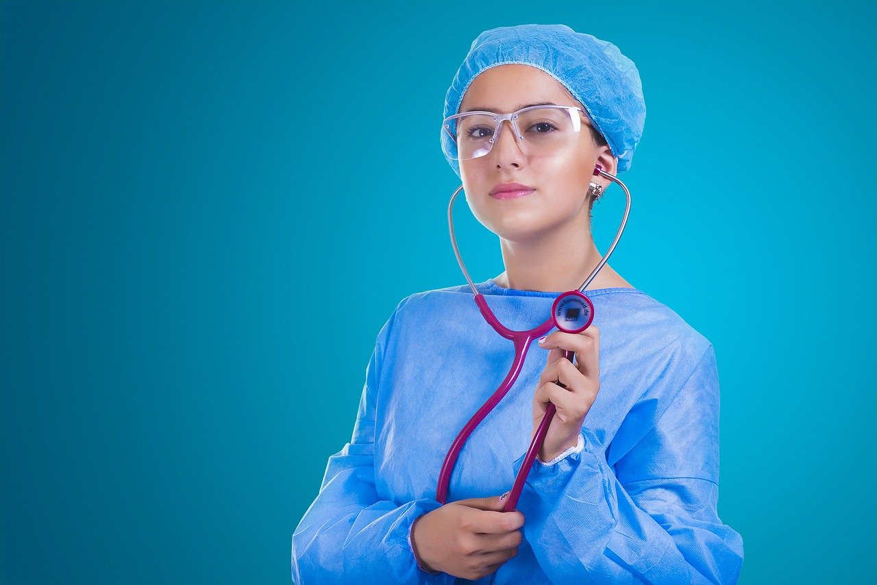 Young nurse in blue putty with stethoscope